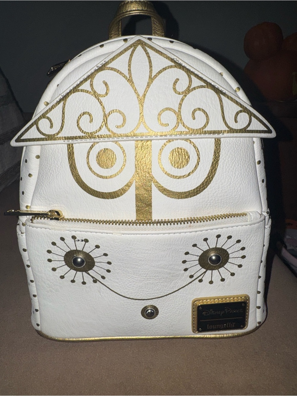 Loungefly White & Gold Mini Backpack with Decorative Face Motif